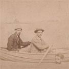 Three men in a fake rowing boat